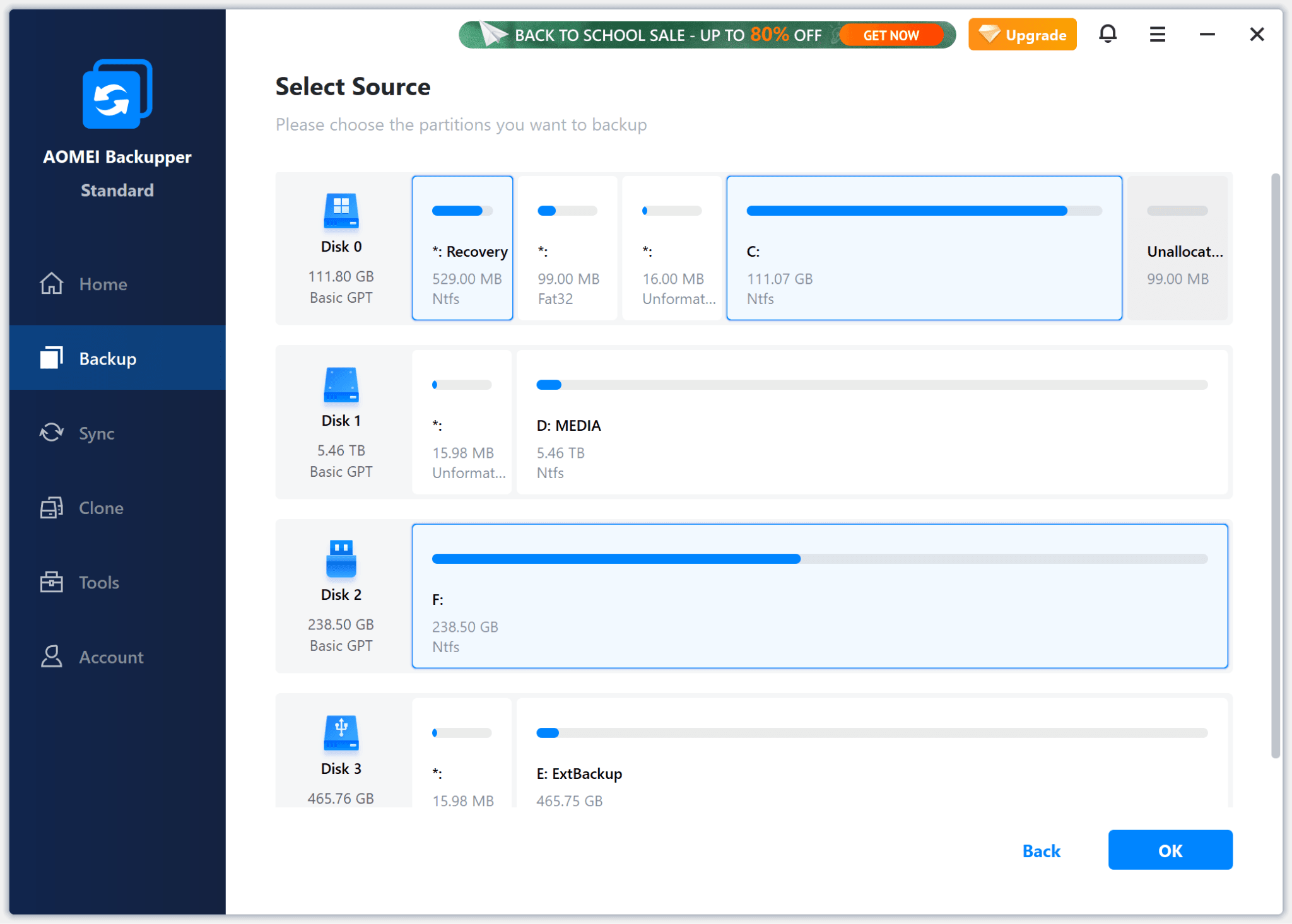 Selecting multiple partitions across several drives for backup in AOMEI Backupper.